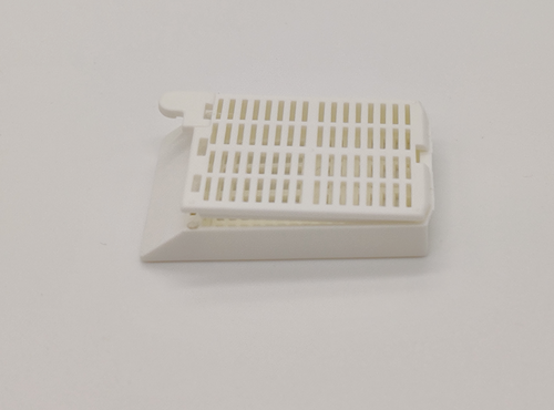 plastic biopsy tissue cassettes with attached lid and 35 angled face white